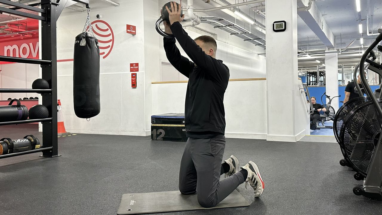 Ollie Thompson performing a kettlebell shoulder press