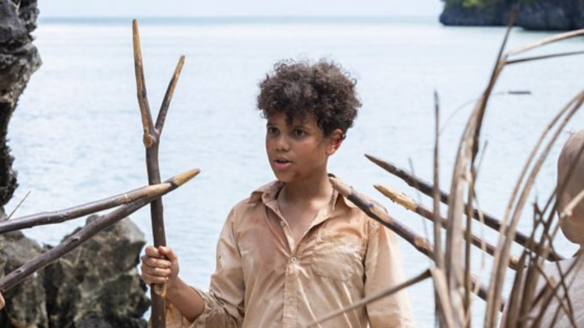 A boy brandishes a sharp stick in Lord of the Flies 2026 