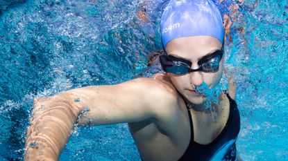 best swimming goggles: Pictured here, young female swimmer wearing the FORM Smart Swim Goggles