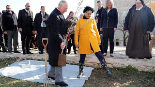 Prince Charles, Prince of Wales plants a sapling during a visit a traditional olive grove and fruit orchard to learn about Palestinian agriculture heritage and traditions at The Carmelite Convent on January 24, 2020 in Bethlehem, West Bank. The Prince of Wales is on a two day trip to the Middle East, meeting with the President of Israel Reuven Rivlin, Holocaust survivors and Palestinian President Mahmoud Abbas.