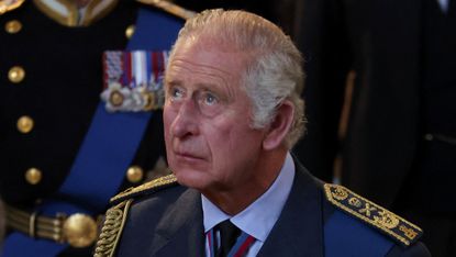 King Charles III walks behind his mother’s coffin in Westminster Hall