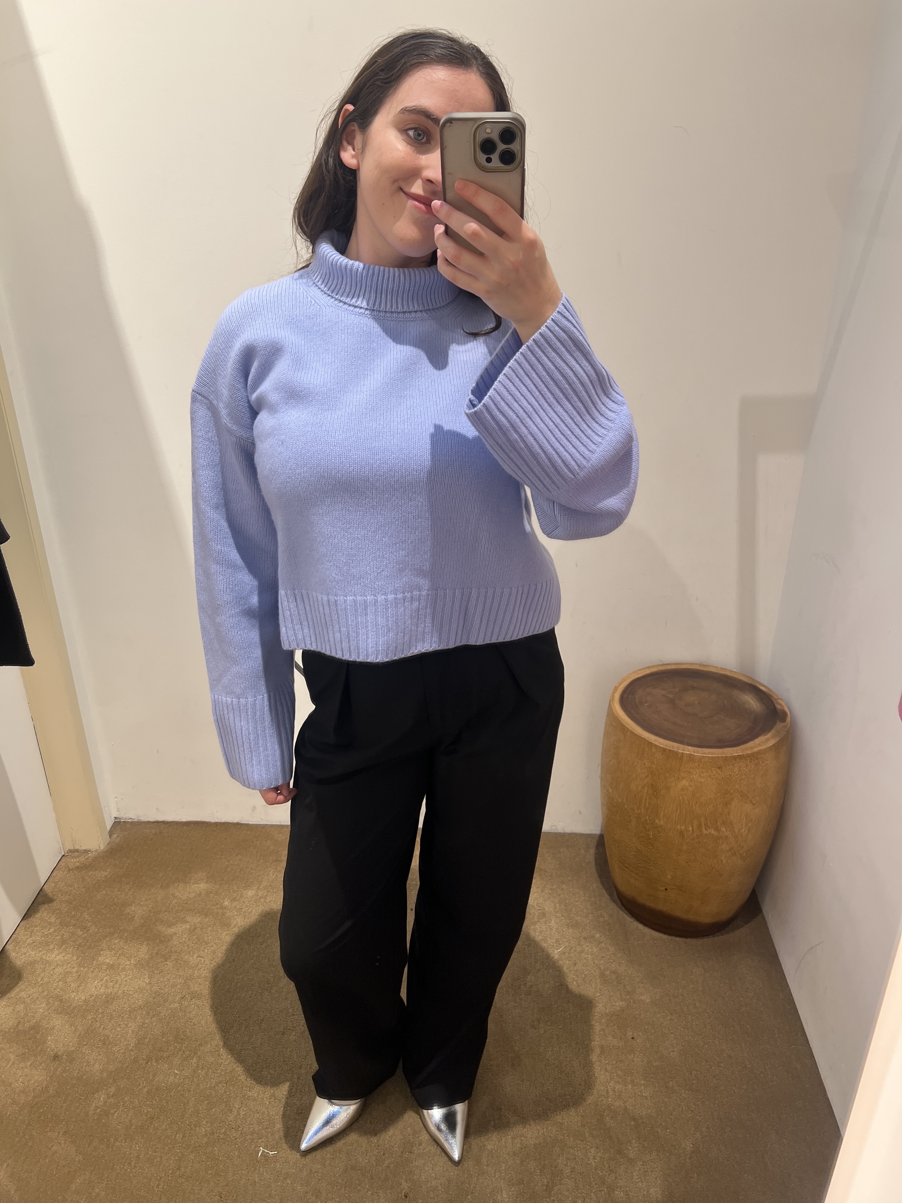 A collage ofBest Knockoff Luxury Clothing
&#039;s Ava Gilchrist wearing a Reformation cropped turtleneck jumper.