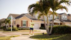 An older man jogs in a Florida neighborhood.