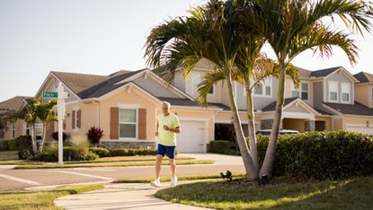An older man jogs in a Florida neighborhood.