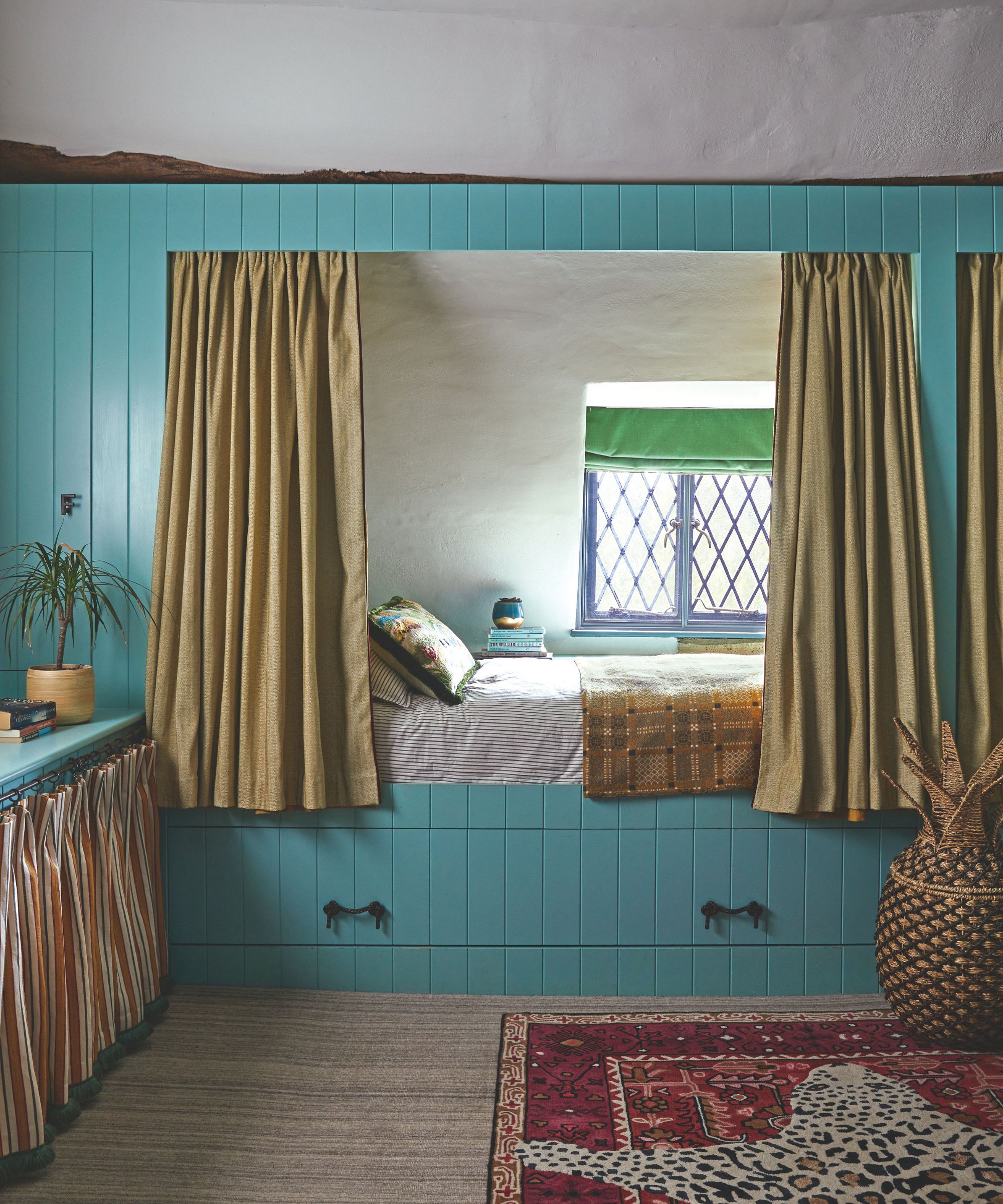 Blue bedroom nook with yellow curtains