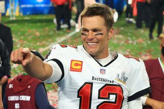 Tom Brady #12 of the Tampa Bay Buccaneers celebrates after defeating the Kansas City Chiefs in Super Bowl LV at Raymond James Stadium on February 07, 2021 in Tampa, Florida. The Buccaneers defeated the Chiefs 31-9. (Photo by Mike Ehrmann/Getty Images)