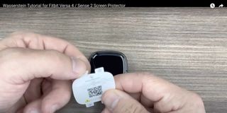 A still from the deleted Fitbit Sense 2 screen protector video