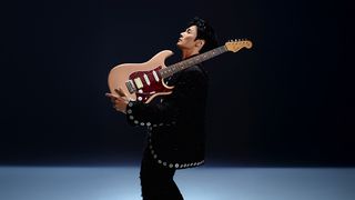 Li Ronghao poses with his signature Fender Strat