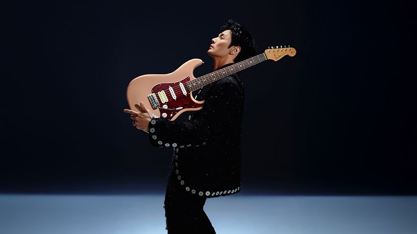 Li Ronghao poses with his signature Fender Strat