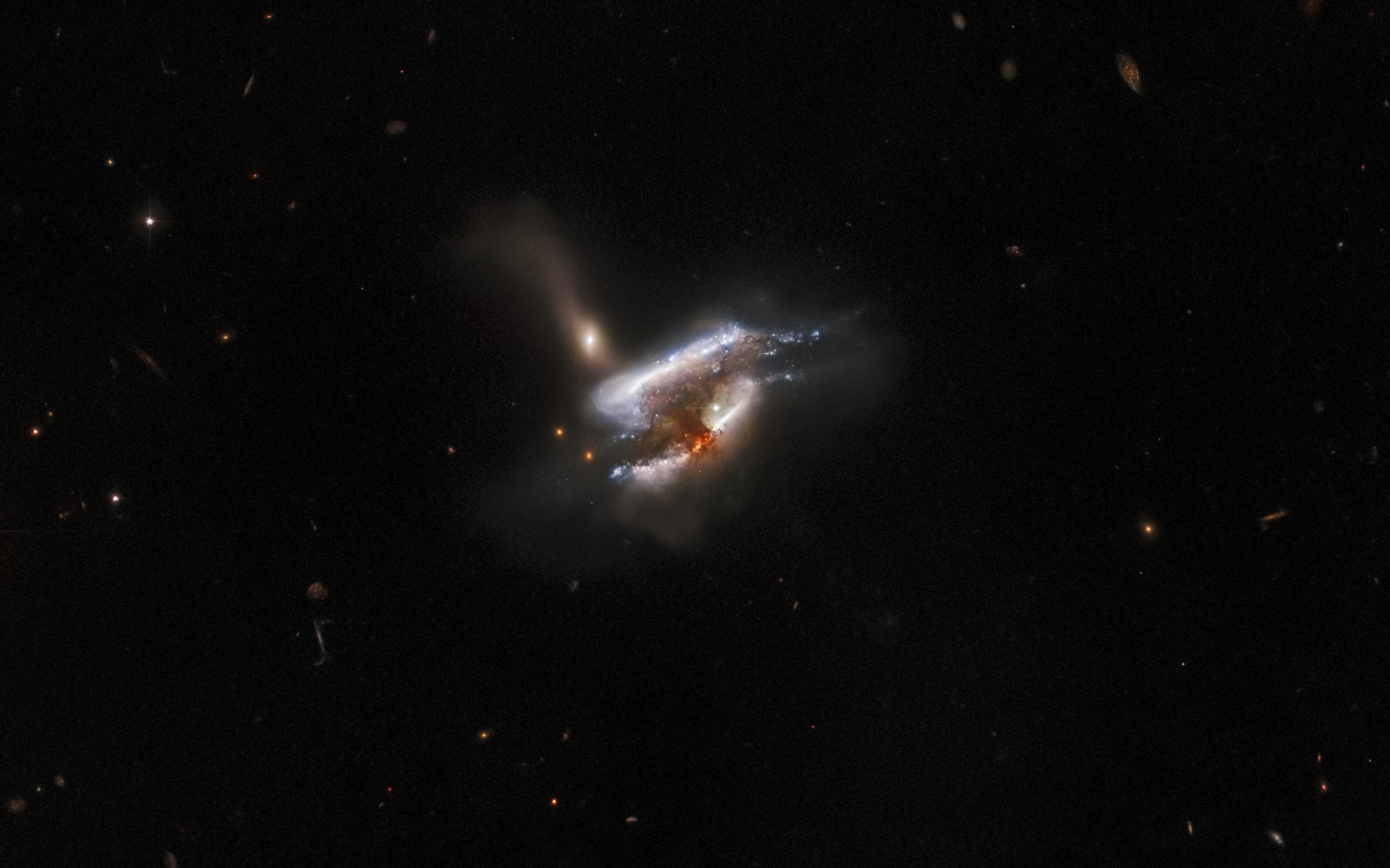 Three galaxies collide in this stunning new Hubble Space Telescope image showing the galaxy cluster IC 2431 about 681 million light-years from Earth.