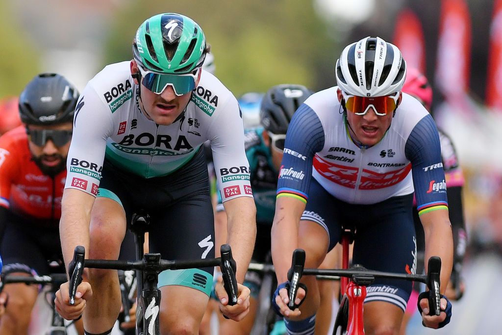 TOURNAI BELGIUM SEPTEMBER 29 LR Jordi Meeus of Belgium and Team Bora Hansgrohe crosses the finish line on second place ahead of Mads Pedersen of Denmark and Team Trek Segafredo sprint to win during the 80th Euromtropole Tour 2021 a 1776km race from La Louvire to Tournai Eurometrotour on September 29 2021 in Tournai Belgium Photo by Luc ClaessenGetty Images
