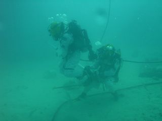 Astronauts Shannon Walker And Steve Squyers Collect Samples