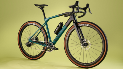 Image shows Canyon Grail gravel bike on green background