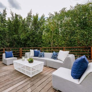terrace with wooden flooring and sofa set