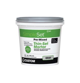 tub of geay thin set tile adhesive