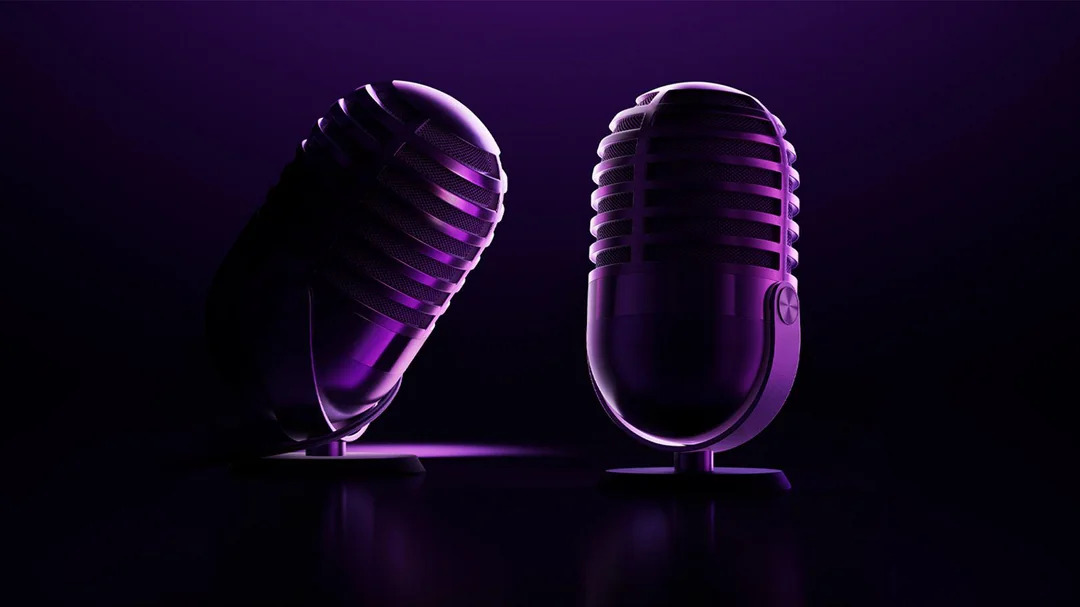 Apple Podcasts 20th anniversary logo shows two microphones in the shape of the number 20
