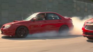 Baby drives his red Subaru in Baby Driver