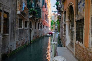 A narrow canal in Venice, Italy in June 2019.