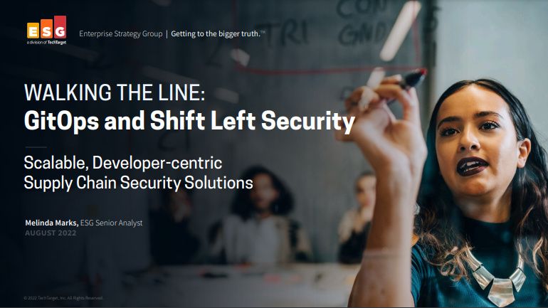 Whitepaper cover with title and logo over image of a female worker facing the camera, writing on a clear board in a meeting with colleagues sat behind her