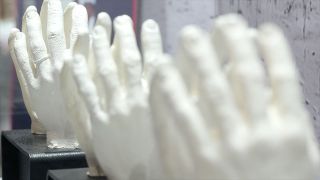 Among the artifacts in "Apollo: When We Went to the Moon" are the hand casts used to size the spacesuit gloves for the Apollo 11 crew, Neil Armstrong, Buzz Aldrin and Michael Collins.