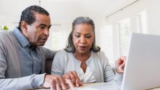 Senior couple compares paperwork to online records 