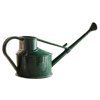 A green Haws watering can from Anthropologie