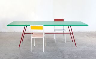 Green table with red & yellow chairs