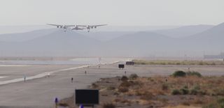 Virgin Galactic's private spaceliner SpaceShipTwo and its carrier plane WhiteKnightTwo take to the skies over the Mojave Air and Space Port in California during an Oct. 7, 2014, glide test of SpaceShipTwo.
