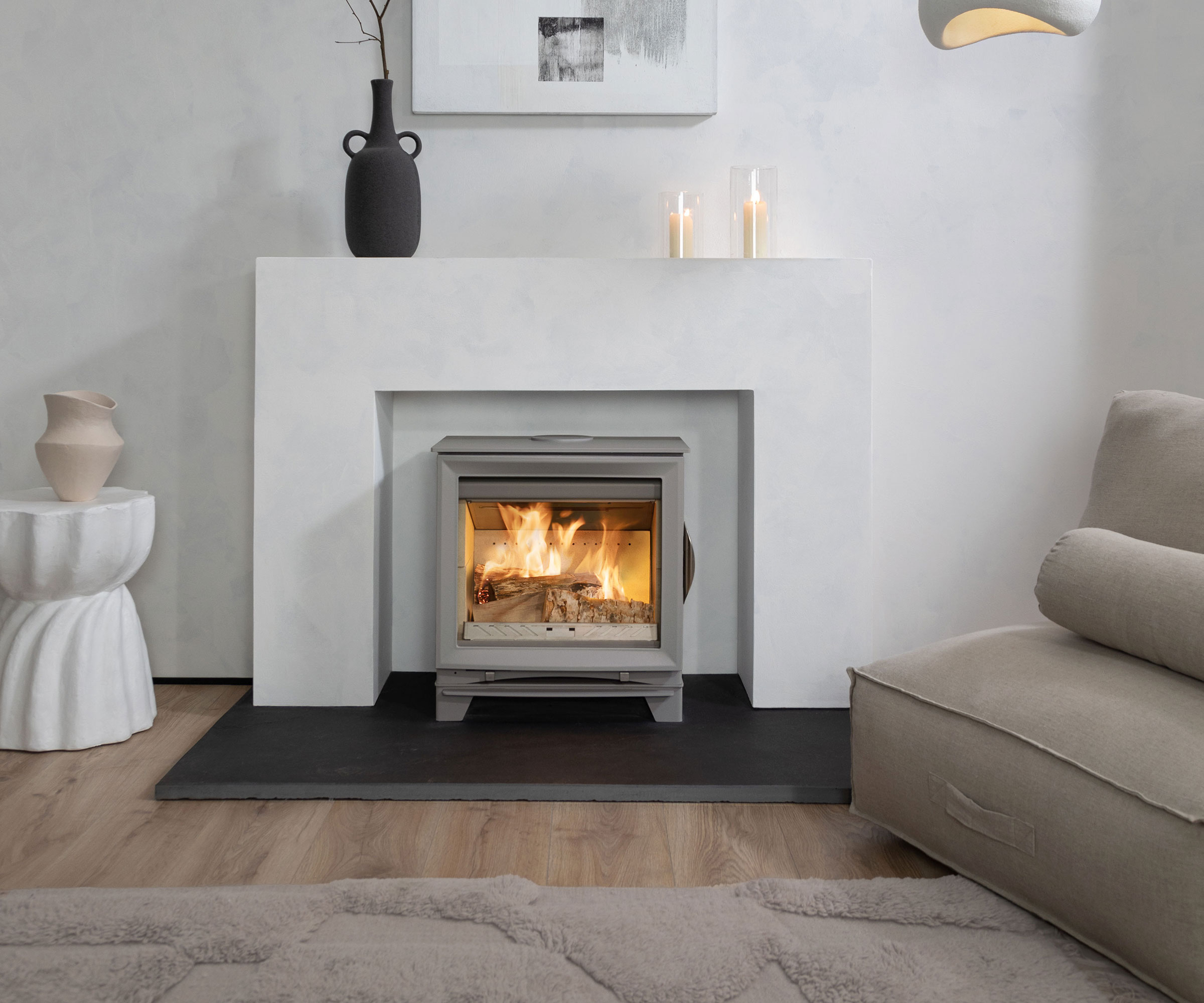 modern white plaster fire surround with log burner