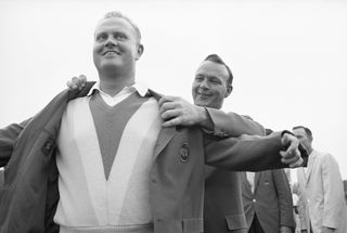 Jack Nicklaus helped into the Green Jacket by Arnold Palmer in 1965
