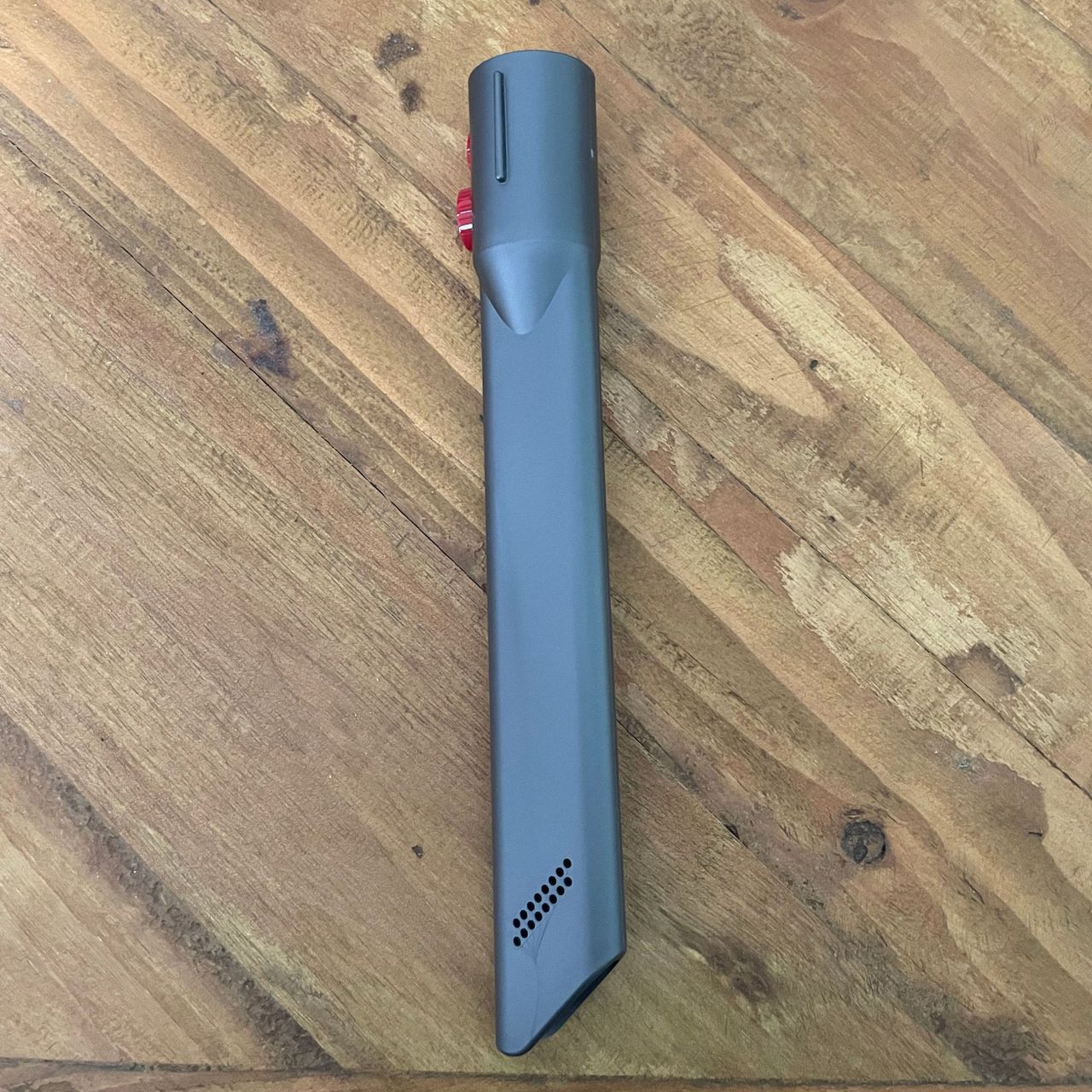 Dyson crevice tool on a wooden table