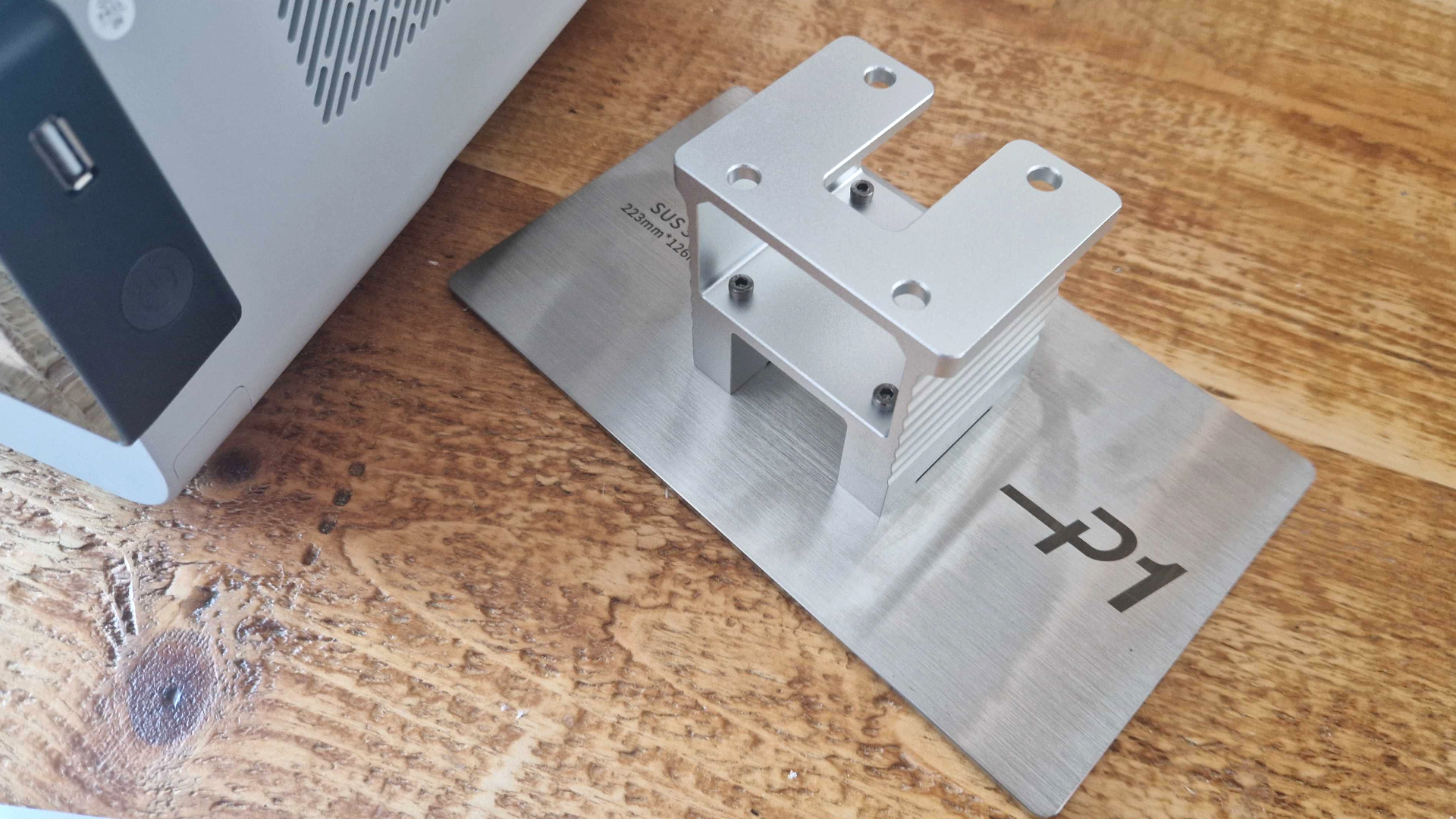 Anycubic Photon P1 build plate on a wooden surface