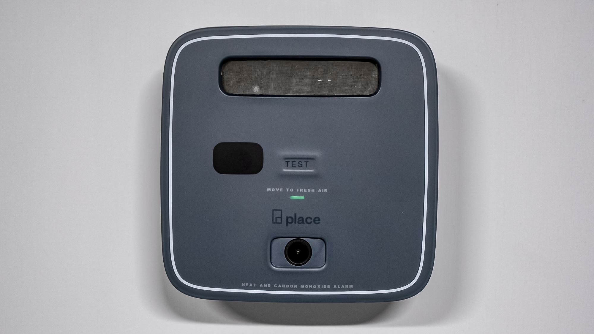 A Place garage alarm mounted on a wall