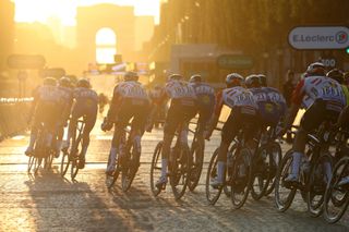 PARIS FRANCE JULY 28 Maxime Monfort of Belgium and Team Lotto Soudal Enric Mas of Spain and Team Deceuninck QuickStep Tim Wellens of Belgium and Team Lotto Soudal Jens Keukeleire of Belgium and Team Lotto Soudal Kasper Asgreen of Denmark and Team Deceuninck QuickStep Julian Alaphilippe of France and Team Deceuninck QuickStep Most Combative Rider Yves Lampaert of Belgium and Team Deceuninck QuickStep Jasper De Buyst of Belgium and Team Lotto Soudal Peloton Sunset Arc De Triomphe during the 106th Tour de France 2019 Stage 21 a 128km stage from Rambouillet to Paris Champslyses TDF TDF2019 LeTour on July 28 2019 in Paris France Photo by Chris GraythenGetty Images