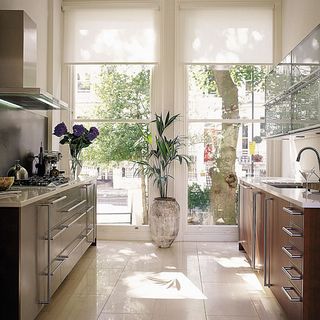 kitchen with white tiles and cabinet