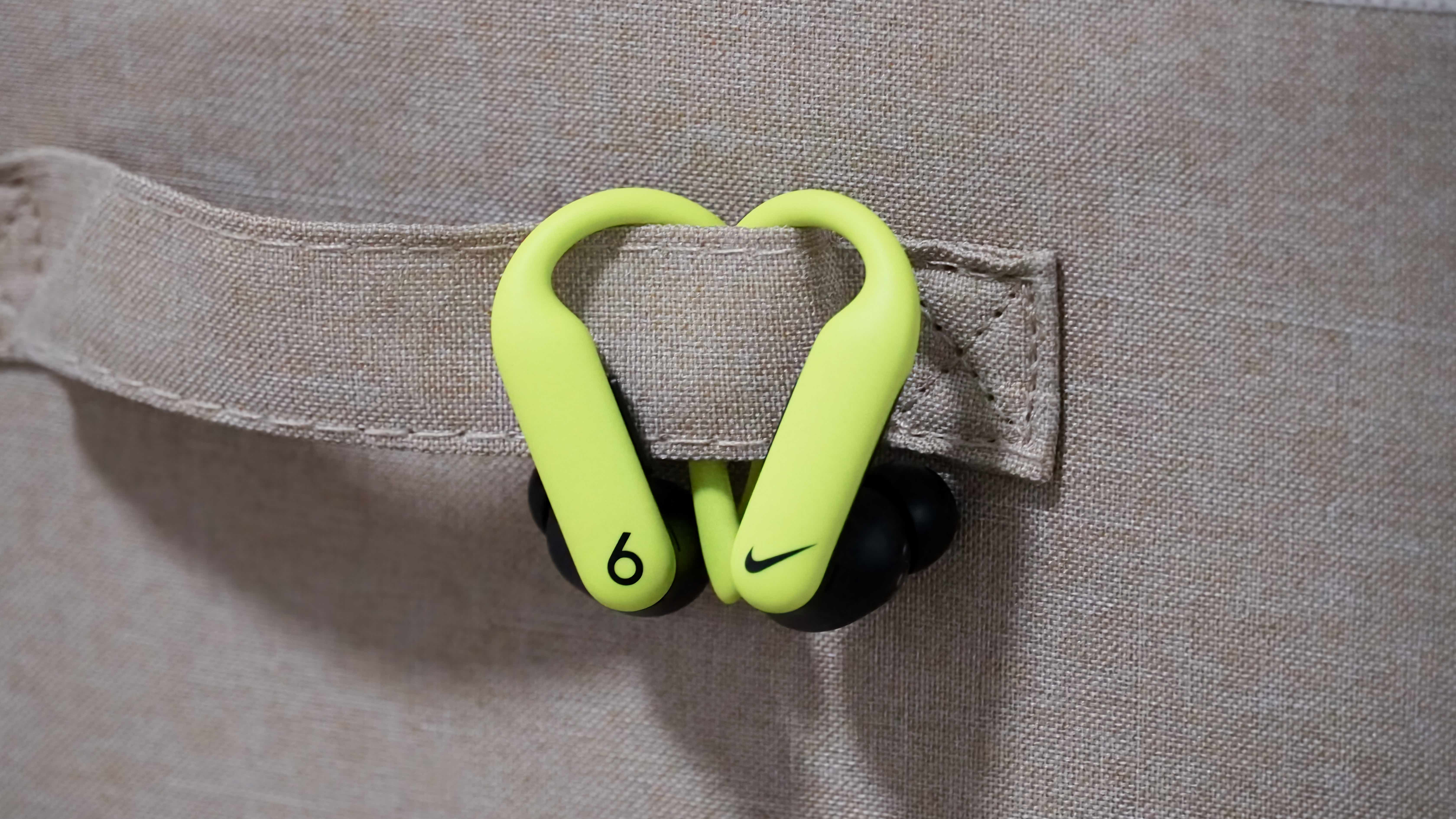 The Nike Special Edition variant of the Powerbeats Pro 2 in a volt and matte black colorway.
