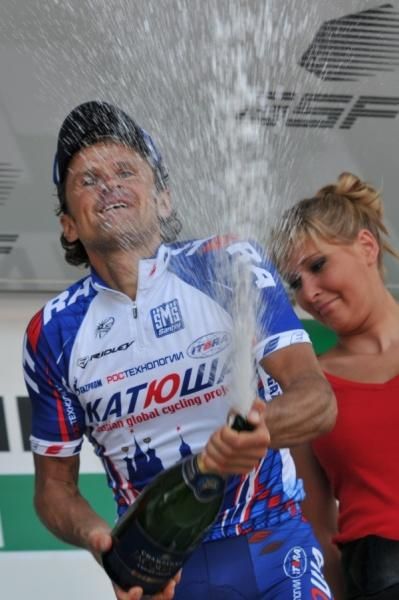 Stage winner Alexandre Botcharov lets loose with the bubbly.