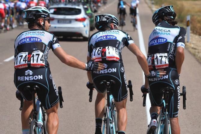 Rigoberto Uran gets a hand from his Omega Pharma-Quick Step teammates