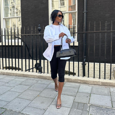 Marilyn in black capris and a white blouse