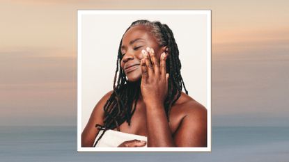 A close up of a woman with dreadlocks applying cream to her cheek with her fingers, to represent suncreen, whilst wearing a white towel/ in a beige and blue sunset-style template