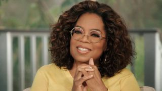 Oprah Winfrey with her hands held together in The Oprah Conversation 