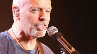 Peter Frampton performing in 2015 while using a talk box