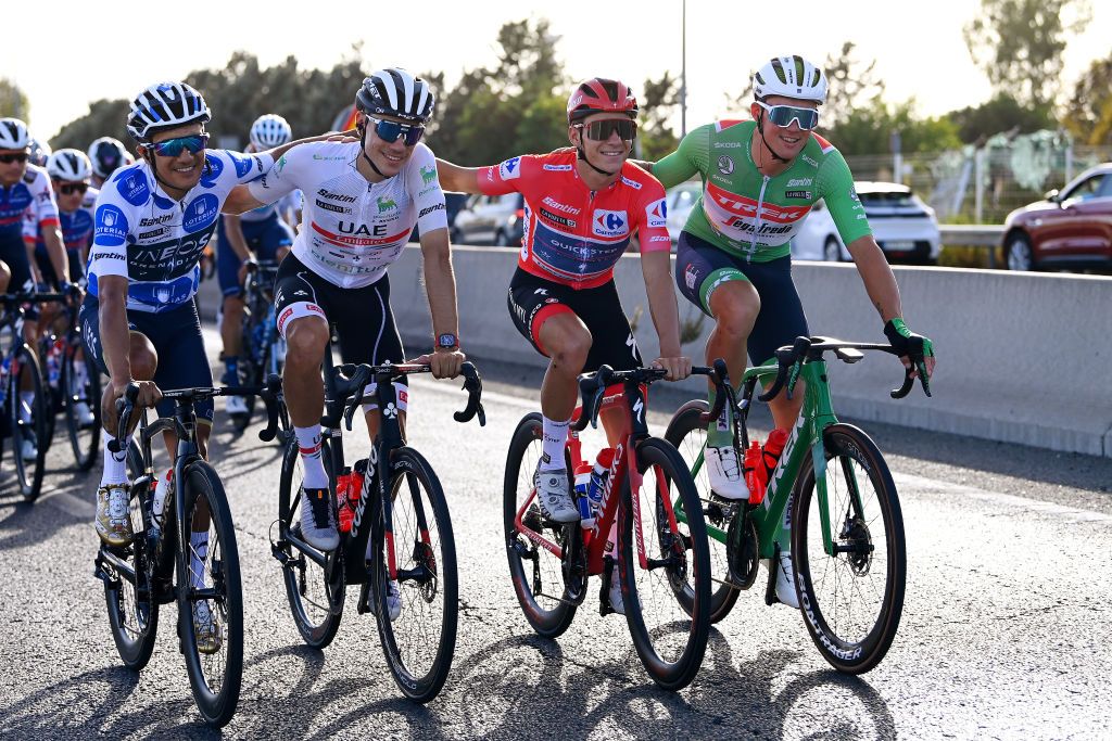 MADRID SPAIN SEPTEMBER 11 LR Richard Carapaz of Ecuador and Team INEOS Grenadiers Polka dot mountain jersey Juan Ayuso Pesquera of Spain and UAE Team Emirates White Best Young Jersey Remco Evenepoel of Belgium and Team QuickStep Alpha Vinyl Red Leader Jersey and Mads Pedersen of Denmark and Team Trek Segafredo Green Points jersey during the 77th Tour of Spain 2022 Stage 21 a 967km stage from Las Rozas to Madrid LaVuelta22 WorldTour on September 11 2022 in Madrid Spain Photo by Tim de WaeleGetty Images