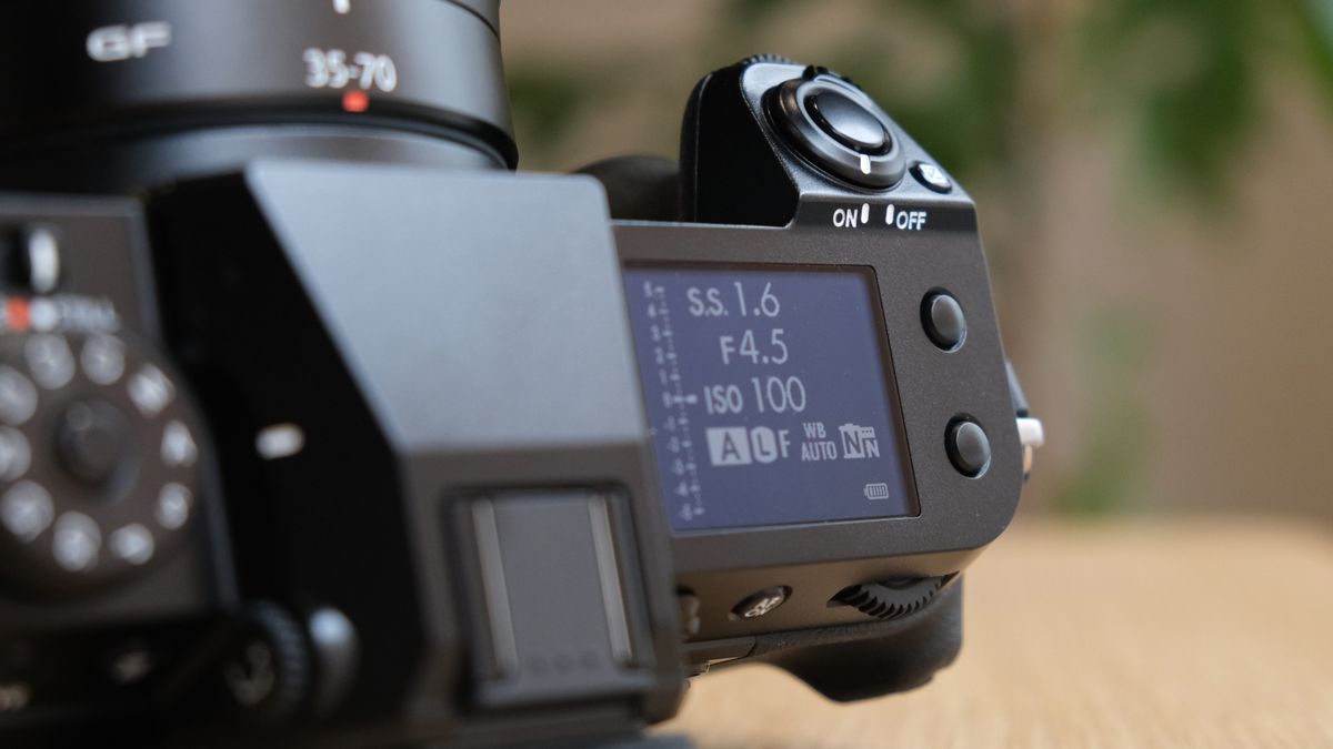 The Fujifilm GFX50S II on a wooden table