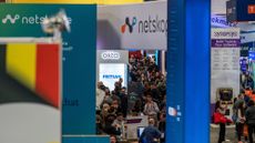 A telephoto shot of the crowds on the RSA Conference showfloor in 2023, surrounded by vendor stalls.