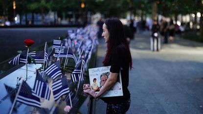 Mercedes Arias, daughter of 9/11 victim Joseph Amatuccio, visits the 9/11 memorial in New York City on Sept. 11, 2024