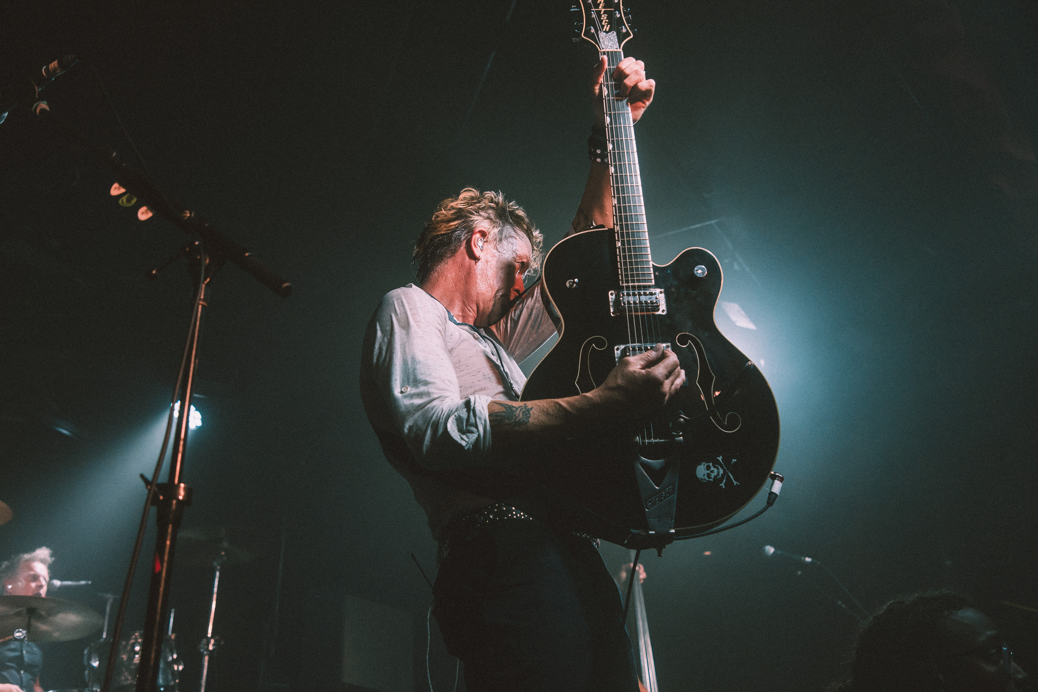 Chris Cheney of the Living End playing a Gretsch guitar live on stage