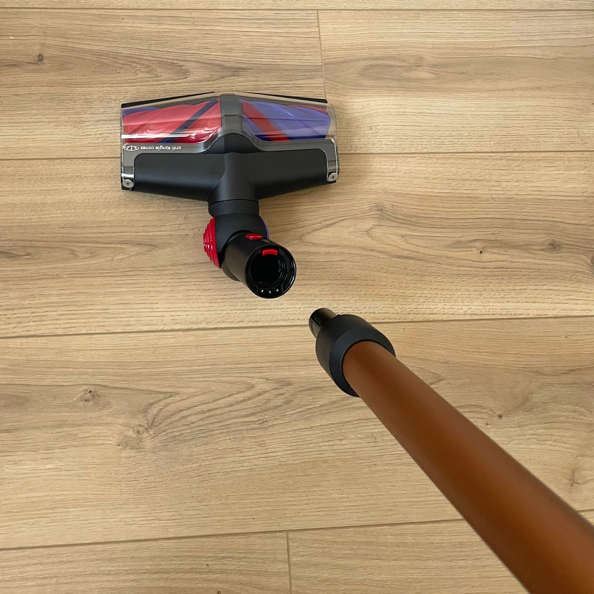 Attaching the extension tube to the Dyson V16 Piston Animal floorhead