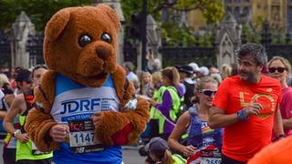 Runner in bear costume taking part in the London Marathon