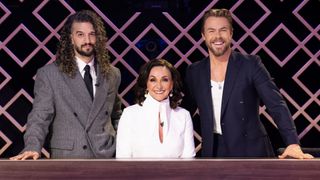 Mark Ballas, Shirley Ballas and Derek Hough sitting at the judges' table for Dancing with the Stars: The Next Pro.